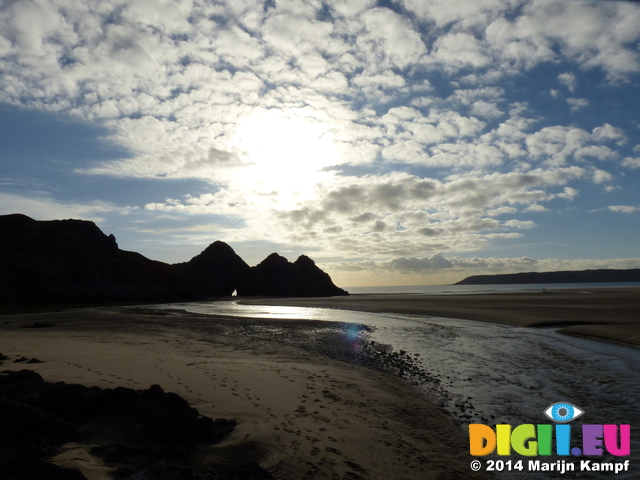 FZ010214 Three Cliffs Bay hole in rocks and river over beach